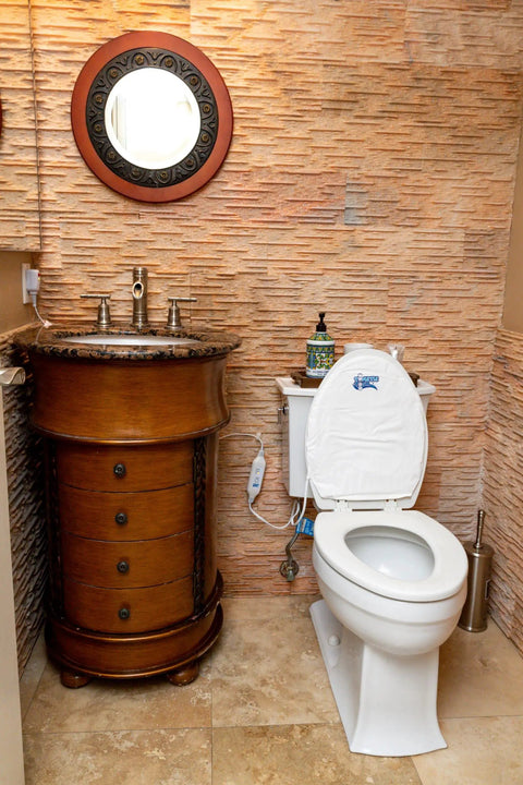 Bathroom showing Cozy Elongated Toilet Seat Warmer With Quick HookAndLoop Mount Waterproof Electric Heated Seat Cover on standard toilet.
