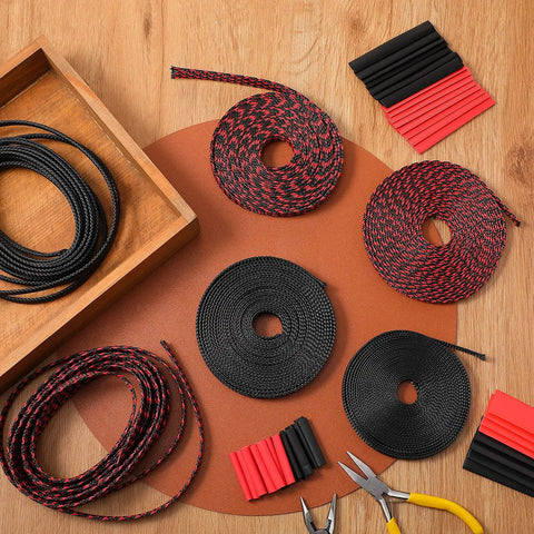 96ft Braided Cable Sleeve Kit With 6 Expandable Sleeves And 127 Heat Shrink Tubes in black and red on a wooden table