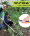 Two Piece Garden Hoe Tools Set With 15.7 Inch Stainless Steel Cultivator Tiller And Pick Mattock Hoe Fiberglass Handle Built For Digging Weeding Loosening Soil And Planting In The Yard Or Garden being used by a woman and child in a garden.