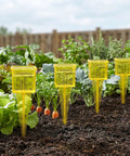 Four Pack Outdoor Rain Gauge With Wide Mouth 1.5 Inch Markings Ground Stake Yard Garden Sprinkler Irrigation Tool Easy Rainfall Readout For Lawn Care Pros High Visibility Yellow Weather Instrument in vegetable garden