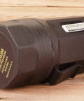 Heavy-duty hexagonal tool component on wooden surface, labeled with brand and specifications, made in the USA