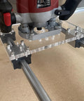 Dead On Precision Router Sled For Wood Slab Flattening Mill with acrylic plate and steel tracks, close-up view.