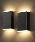 Hella Bright Solar Wall Light Outdoor Featuring Slick Up And Down Lighting mounted on a textured wall, showcasing dual illumination.