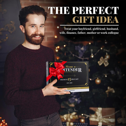 Man holding gift-wrapped Ultimate Home Bar Mixology Kit With Stand 15 Piece Silver Bar Tool Set for Crafting Dope Cocktails at Home.