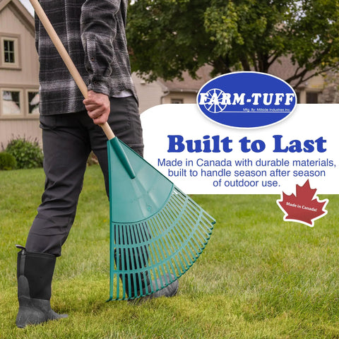 Man holding Extra Wide 24 Inch Leaf And Lawn Rake With 48 Inch Hardwood Handle for Quick Yard Cleanup on grass