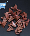 Straight Up Heavy Duty Brown Plastic Shelf Pegs 20 Count Offering Five Millimeter Diameter And Eight Millimeter Length For Bookcase Cabinet Hardware Plus Cupboard Shelves No Sweat Setup, brown pegs arranged.