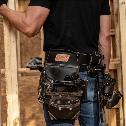 Heavy Duty Tool Belt And Rig With TrapJaw Pockets on carpenter's waist, pro organizer for 50-inch adjustable fit, black and brown design.