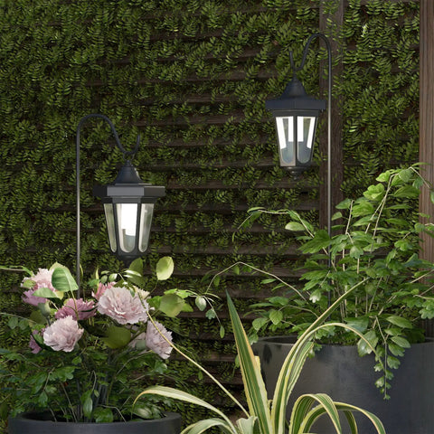 Set Of 2 Solar Lanterns For Outdoors, Waterproof Hanging LED Lights With Shepherd Hook Mounts in garden setting.