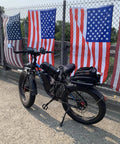 6000W Peak Dual Motor Fat Tire Electric Bike For Adults with flags in background