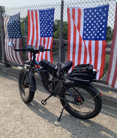 6000W Peak Dual Motor Fat Tire Electric Bike For Adults with flags in background