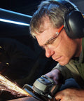 Man wearing Two Pack SonicSeal Hearing Protection Earmuffs for Shooting, Range, and Hunting, 31.5 dB SNR Noise Reduction using power tool