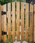Wooden gate with 3.5 Inch Heavy Duty Gate Hinges 2 Pack Black Iron Extra Thick T Gate Hinges installed outdoors