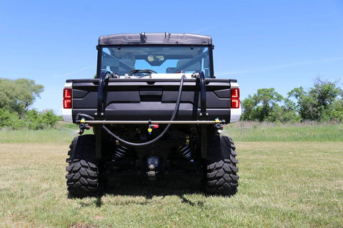Rear view of 50 Gallon UTV Broadcast Sprayer With Precision And Boomless Booms Up To 30 Foot Swath 3 GPM EZ Lock Boom Mount on grass