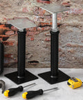 Two Pack Adjustable Floor Jack Posts 9.5 To 13.5 Inch Height Durable Carbon Steel Screw Posts on workshop floor with tools