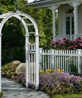 Durable White Vinyl Arbor For Outdoor Garden Pathway 49 Inch Wide By 91 Inch High, No-Fuss Low Maintenance, shown amidst garden flowers.