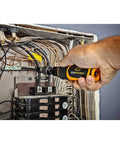 Person using Go-To Quarter Inch Drive Torque Screwdriver With Locking Collar For Precise Settings on electrical panel