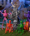 Spooky Hanging 16 Inch Posable Skeleton Set for Halloween decor, colorful skeletons around tombstone with lantern and pumpkin