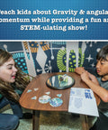 Two kids observing Euler's Disk Kinetic Toy with Interchangeable Foils on table, STEM educational display for kids 8 and up
