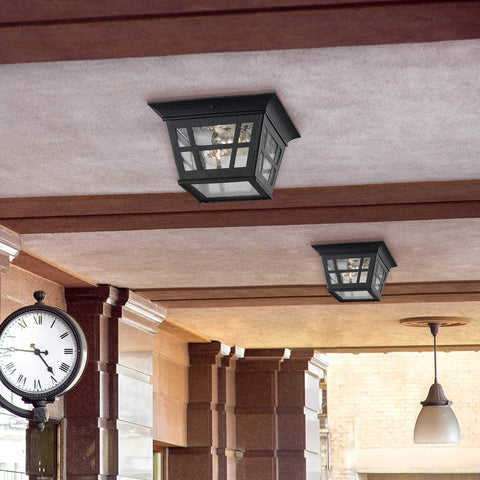 Herrington Two Light Outdoor Ceiling Flush Mount Fixture in black finish installed on patio ceiling