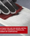 Gloved hand using Maroon Very Fine General Purpose Hand Pad 6x9 Inch Aluminum Oxide Abrasive for surface prep on metal