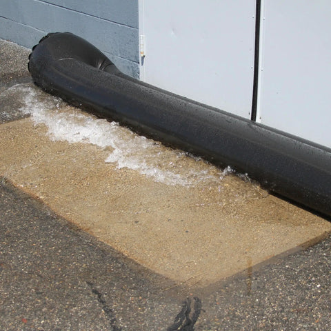 Reusable Water-Filled Flood Barrier Curb for Quick Home Flood Defense blocking water near a building entrance, heavy-duty PVC, 6.5in x 10ft