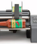 Hustle Ready Semi Automatic Label Applicator For Cylindrical Bottles Cans Jars And Tubes With No Sweat Setup, applying label to bottle.