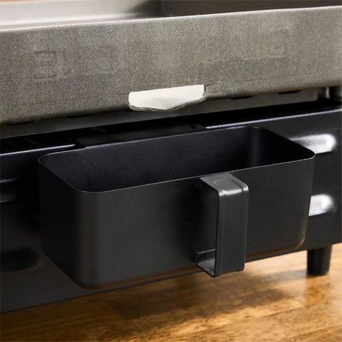 Close-up of grease catcher on Portable 17 Inch Tabletop Griddle With Stainless Front Plate And Powder Coated Steel
