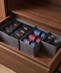 Super Sturdy Foldable Drawer Clothing Organizer Set Eight Piece Gray Fabric Wardrobe Dividers sorting ties and socks in a drawer.