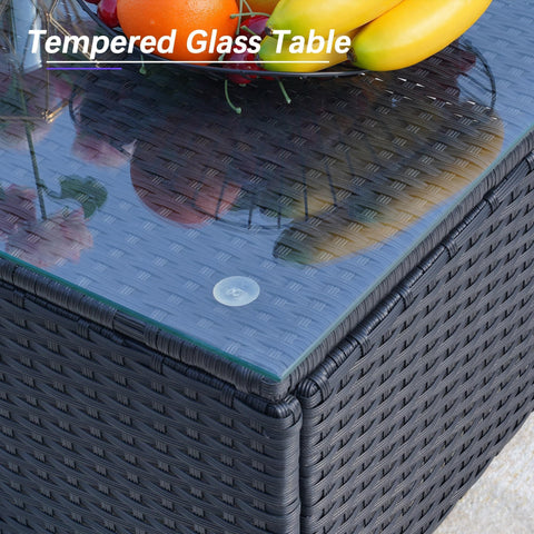 Close-up of the All Weather 7 Piece Outdoor Sectional Sofa Set With Waterproof Cover Wicker Patio Furniture Including Coffee Table Cushions And Rust Resistant Frame Blue Backyard Hangout Conversation Set For Garden And Patio featuring a tempered glass table with wicker base.