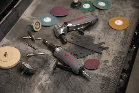 Badass 1/4 Inch Collet Air Die Grinder Rocking Zero Point Four Horsepower And Twelve Thousand Rpm with assorted grinding tools.