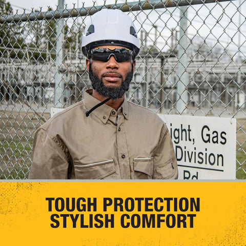 Industrial worker wearing Trim-Fit Half Frame Safety Eyewear For Unisex Outdoor Work And Play, black frame, clear lenses.