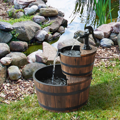 Go-To Wood Freestanding Two Tier Waterfall Barrel Fountain With Electric Pump For Garden Decor in a garden setting