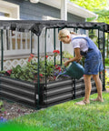 Woman using Galvanized Raised Garden Bed With Crop Cage Net Tent And Shade Cloth Kit For Outdoor Veggies And Fruits, Bird And Pest Protection, Bottomless Planting Metal Planter Box With T Nuts And Wing Nuts, 6x3x1 Ft in yard