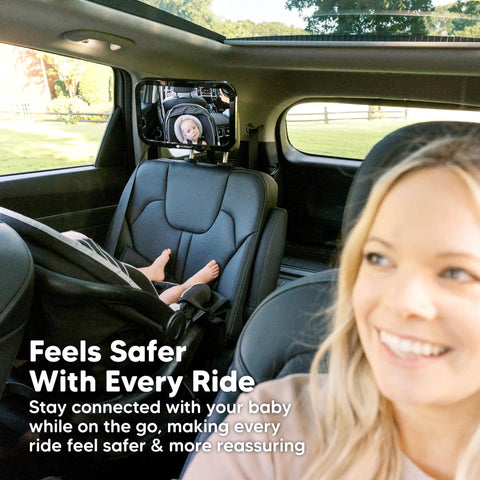 Wide 360 Degree Crystal Clear Baby Car Seat Mirror For Rear Facing Seats in backseat with child and smiling parent in front seat.