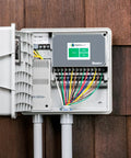 Hydrawise Pro HC 24 Station WiFi Smart Sprinkler Controller for Outdoor Irrigation Timer mounted on wood siding