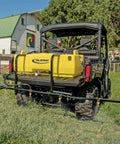 65 Gallon UTV Sprayer With 7 Nozzle Folding Boom 140 Inch Spray Width 4 GPM 12V Diaphragm Pump on UTV in pasture