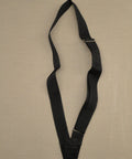 Black Single Web Sling Carrying Belt For Parade Flagpole Holder And Color Guard Gear on beige background
