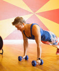 16 Inch High Velocity Drum Fan With Pivoting Head Turbo Power in a gym setting, providing cooling during a workout session.