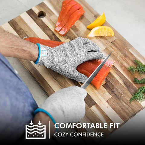 Person using Ultra Safe Cut Resistant Gloves Level 5 Protection for kitchen prep, slicing salmon fillet with grey gloves, XL size.