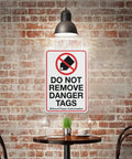 Industrial Grade Aluminum Safety Sign 8x12 Inch No Tampering Lockout Caution Plaque on brick wall in dimly lit space