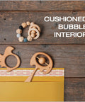 Bubble Mailers 8.5 X 11 Inch Kraft Padded Envelopes With Self Seal Closure cushioning toys on wooden surface.