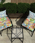 Outdoor setup with All Weather Tufted Wicker Chair Cushions Set Of 2 For Outdoor Patio Or Indoor Use, 19 Inch By 19 Inch By 4 Inch, Paisley design.