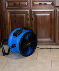 Heavy Duty Industrial Workhorse High Velocity Whole Room Air Mover And Circulator Fan 14 Inch 2100 CFM placed on kitchen floor