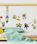 Minions The Rise Of Gru Peel And Stick Vinyl Wall Decals Set Of 30 on kids' room wall above bed with blankets