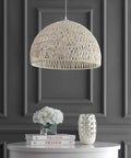 Cream Modern Boho Rope LED Pendant Light Fixture With Adjustable Dome Ceiling Lamp For Kitchen Island, Rope Shade, Coastal Farmhouse Decor, LED Bulbs Included, Easy Install, Cozy Dope Glow hanging over a table.