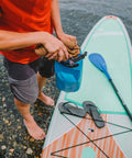 Person using Quick Dry Microfiber Towel For In Field Or Gym Large 30 By 50 Inches In Coyote Color Ultra Absorbent And Ultra Compact