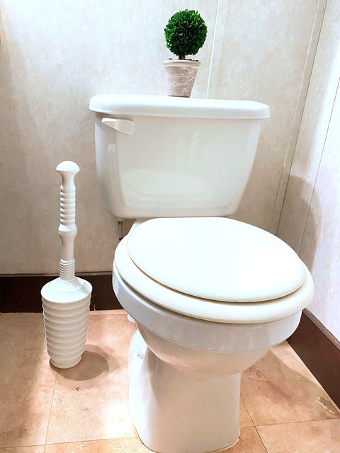 Heavy Duty Toilet Plunger Kit With Smart Air Relief Valve And Spacious Tall Bucket Caddy Effortlessly Knocks Out Stubborn Drain Clogs Fast No Hassle Cleanup For Quick Home Plumbing Fixes In White next to a toilet in a bathroom.