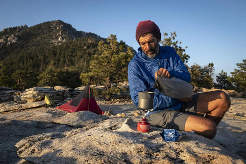 Camper using PocketRocket 2 Ultralight Camping Stove Kit for Solo Backpackers, Lightweight Yet Tough Mini Stove Boils 1 Liter
