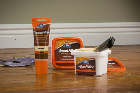 Interior Wood Filler For Holes Dents Scratches And Gouges In Wood Wallboard Molding And Painted Surfaces 16 Oz container on floor