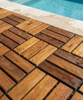 Teak Wood Interlocking Floor Tiles EZ Floor 12x12 Inch Pack Of 10 Solid Brown by a pool, showing water-resistant outdoor use.